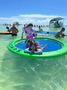 Children playing on the Islamorada Sandbar during an Island Adventures Islamorada Sandbar Tour